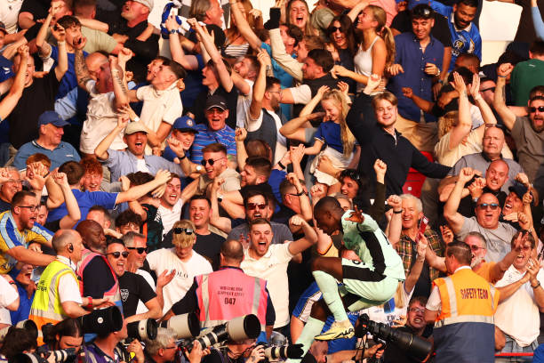 NOTTINGHAM, ENGLAND - MAY 11: Nicolas Jackson of Chelsea celebrates scoring his team's third goal with the fans during the Premier League match between Nottingham Forest and Chelsea FC at City Ground on May 11, 2024 in Nottingham, England. (Photo by Marc Atkins/Getty Images)