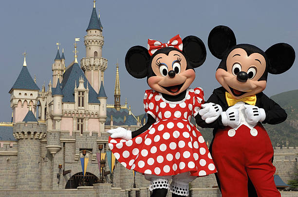 HONG KONG - SEPTEMBER 1: (EDITORIAL USE ONLY)  In this handout photo provided by Disney, Mickey and Minnie Mouse are seen in front of the Sleeping Beauty Castle at the new Disneyland Park on September 1, 2005 in Hong Kong.  The new theme park and vacation resort will officially open September 12.   (Photo by Mark Ashman/Disney via Getty Images)